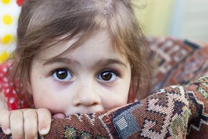 Portrait of cute sad little girl