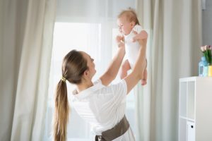 Woman holding newborn baby