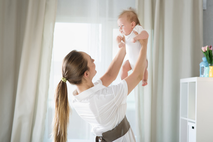 Woman holding newborn baby