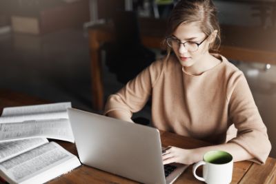 Woman typing on computer.