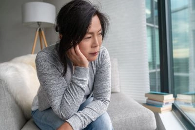 Sad-Asian-mature-woman-lonely